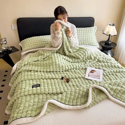 Soft mint green quilted flannel velvet blanket with plush white fleece lining and subtle home brand patch decorbites cozy flannel