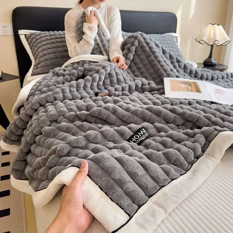 Gray plush throw blanket with textured wavy knit and cream fleece lining from decorbites cozy flannel velvet collection