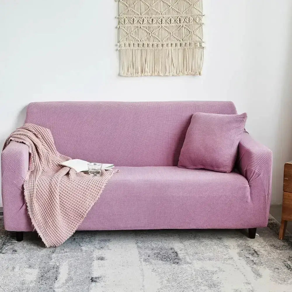 A soft lavender textured purple cozy fleece sofa slipcover snugly fits over living room furniture for decorbites cozy fleece