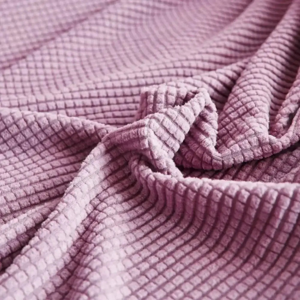 Soft lavender textured purple cozy fleece sofa slipcover with a waffle-knit pattern for living room furniture wrap