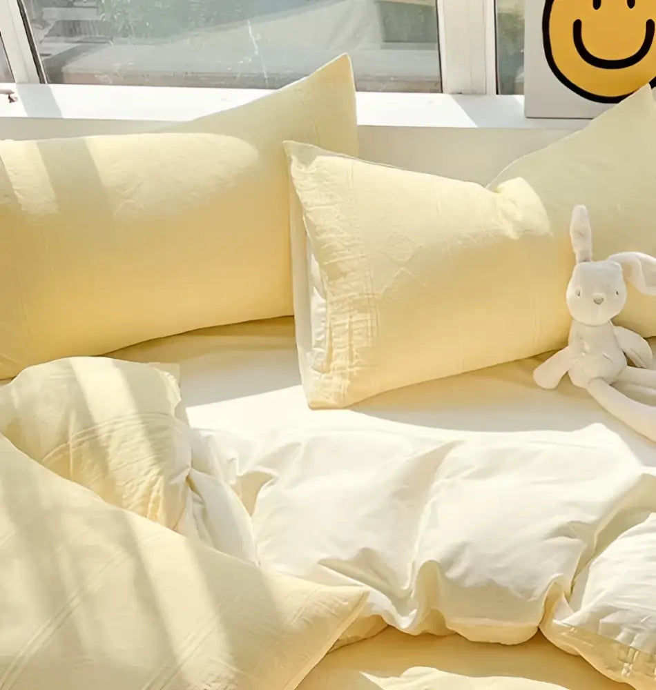 Soft pale yellow decorbites cotton three-layer bedding set with subtle texture and gentle folds for bedroom decor