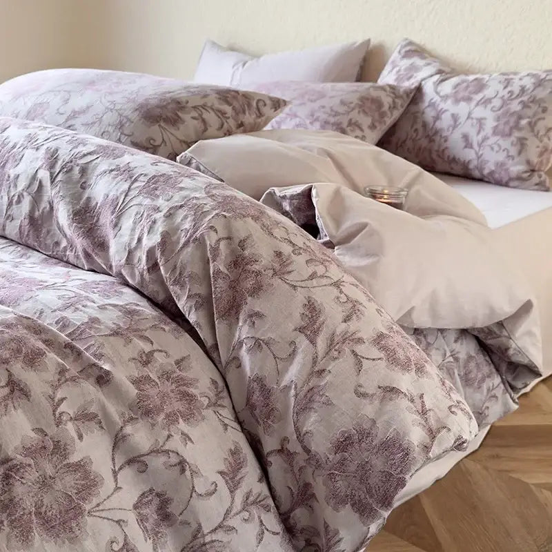 A mauve-toned floral duvet cover with elegant embroidery in a textured soft yellow decorbites cotton bedding set