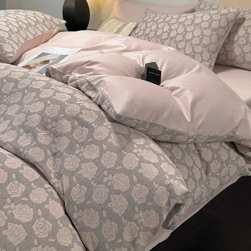 A soft blush-pink satin duvet cover with subtle gray rose pattern in a textured soft yellow decorbites cotton bedding set