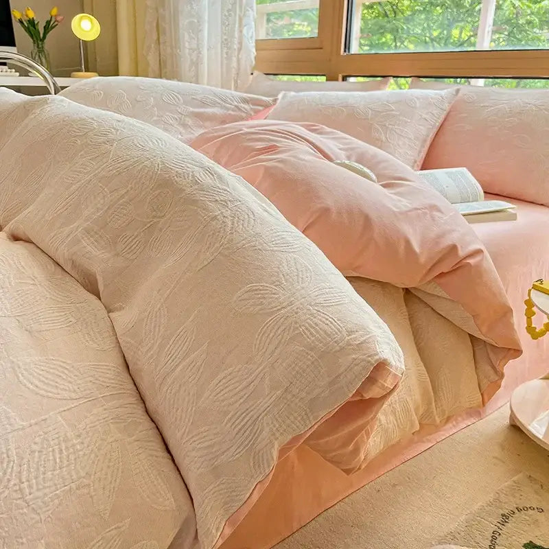 Soft blush pink quilted duvet set with subtle floral embroidery made of decorbites cotton three-layer bedding set