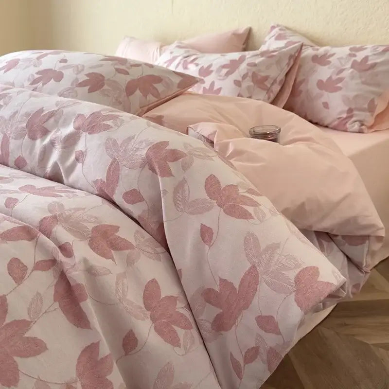 Pink floral-patterned duvet cover set with delicate leaf designs in soft tones featuring decorbites cotton bedding set