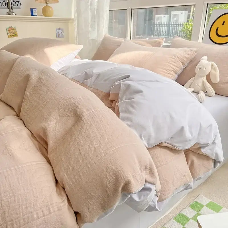 Soft beige decorbites cotton three-layer bedding set with textured duvet cover and matching pillows for bedroom use