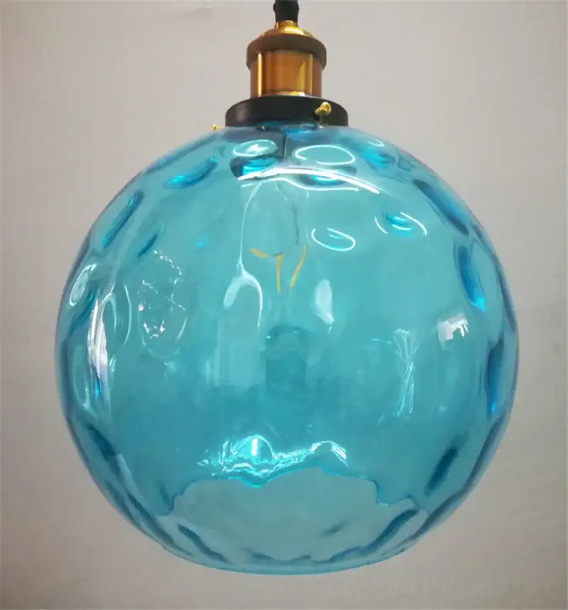 Textured turquoise blue glass ball pendant light with bubble surface and brass fixture ideal for pendant lights decorbites blue glass
