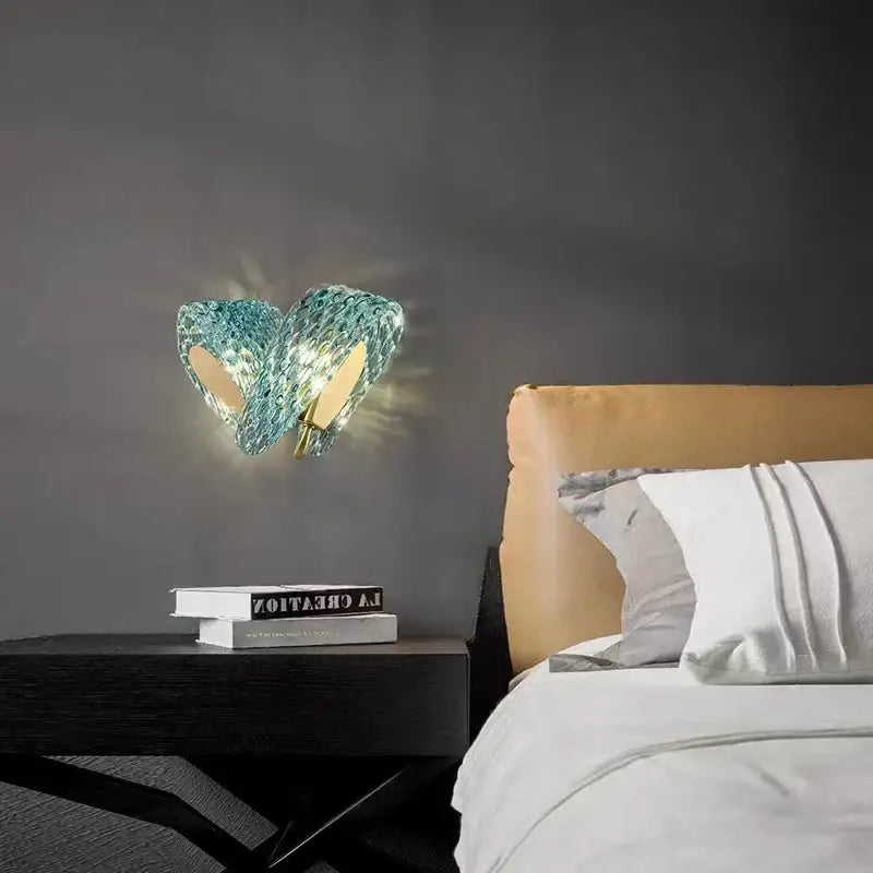 Textured turquoise blue glass luxury wall sconce with faceted design and gold-toned accents by decorbites blue glass