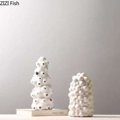 Textured white ceramic vase set with bubble-like surfaces and circular holes featuring artificial flowers for living room