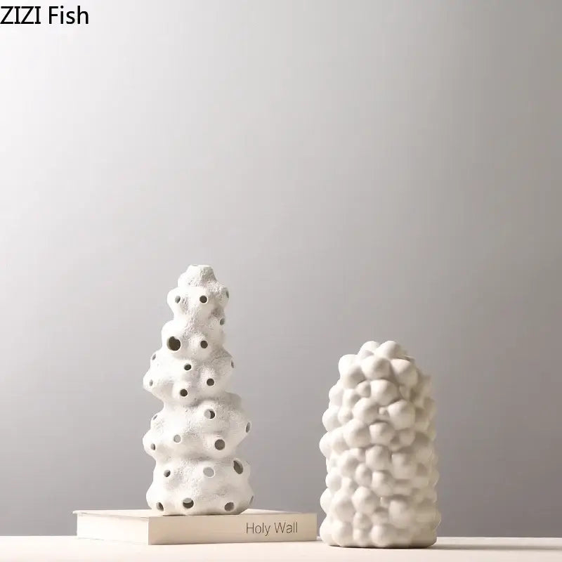 Textured white ceramic vase set with bubble-like surfaces and circular holes featuring artificial flowers for living room