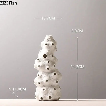 White ceramic coral sculpture vase set with textured porous surface and circular openings for artificial flowers