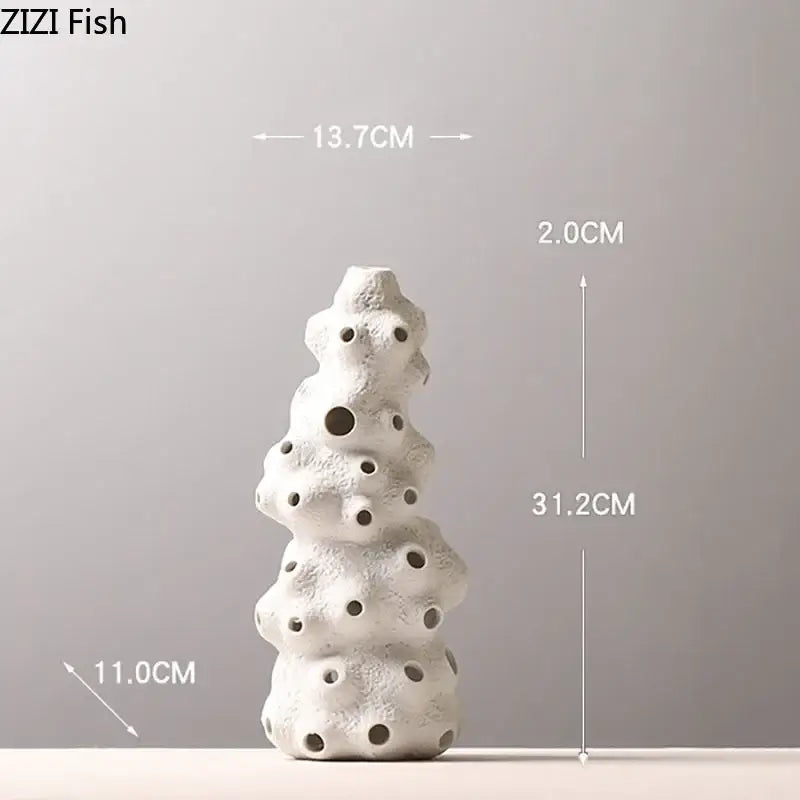White ceramic coral sculpture vase set with textured porous surface and circular openings for artificial flowers