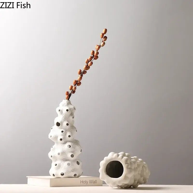 White textured ceramic vase set with porous surface and artificial flowers for living room decor
