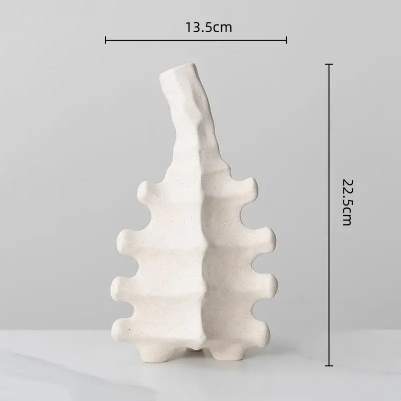 Textured white geometric decorbites ceramic vase with a leaf silhouette and serrated edges for home decor