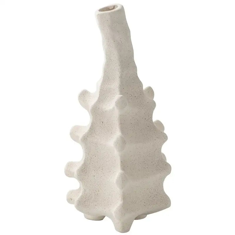 A textured off-white decorbites ceramic vase with a tall slender neck and spiky segmented body for home decor