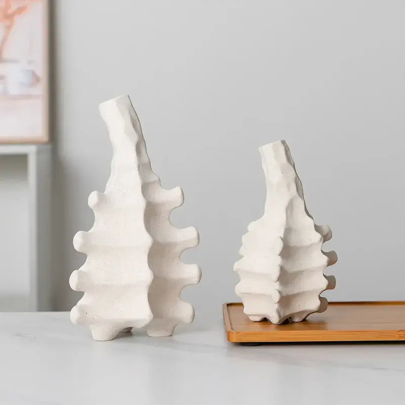Two off-white textured ceramic bookends with ribbed spine design for home decor by decorbites ceramic vase collection