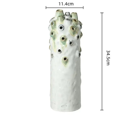 Textured white and green coral ball ceramic vase with sculpted surface featuring circular openings for living room decorbites coral ball