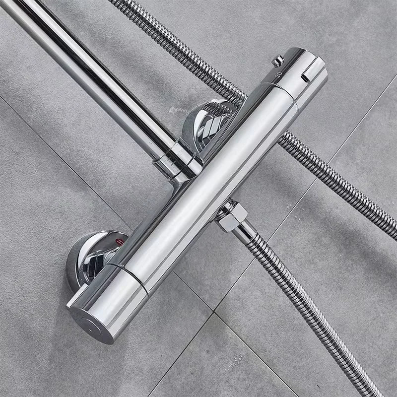 Chrome thermostatic bathtub shower faucet with dual handle wall-mounted mixer and flexible braided hoses visible from back side