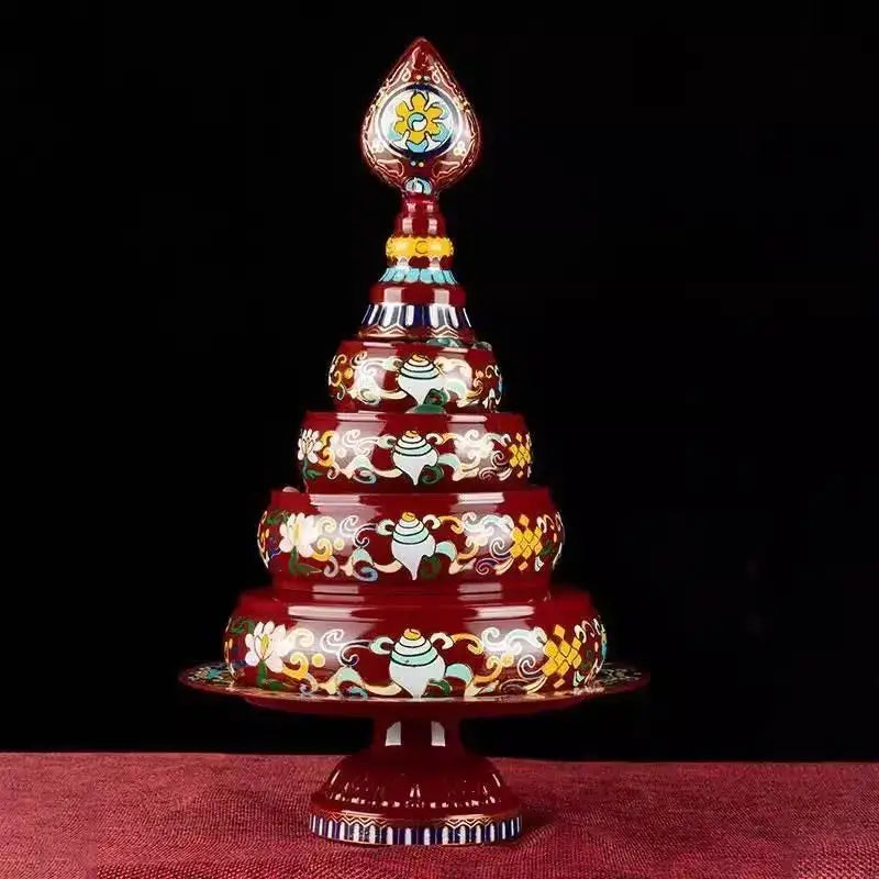 A richly decorated red tibetan tea pan with intricate gold white and turquoise cloisonné manda pan decorbites design
