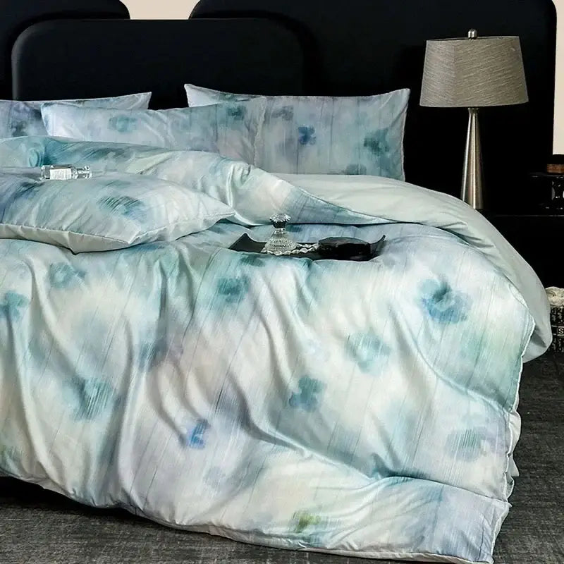 Light blue and white tie dye cotton bedding set with a soft satin finish from decorbites cotton bedding collection