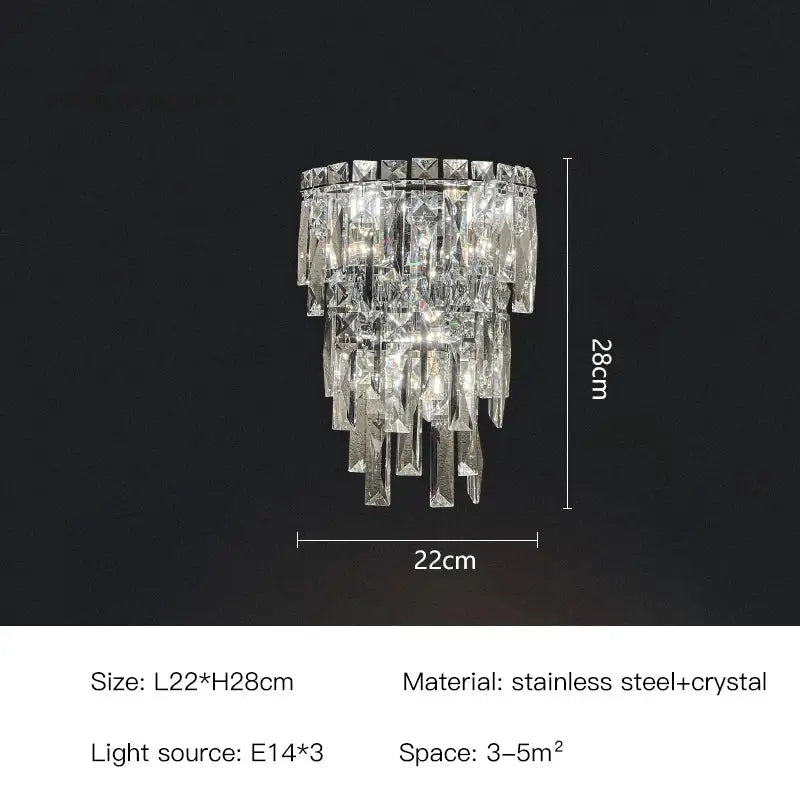 A tiered cascading crystal wall light with clear faceted crystals and a sleek stainless steel frame for luxury decorbites decor