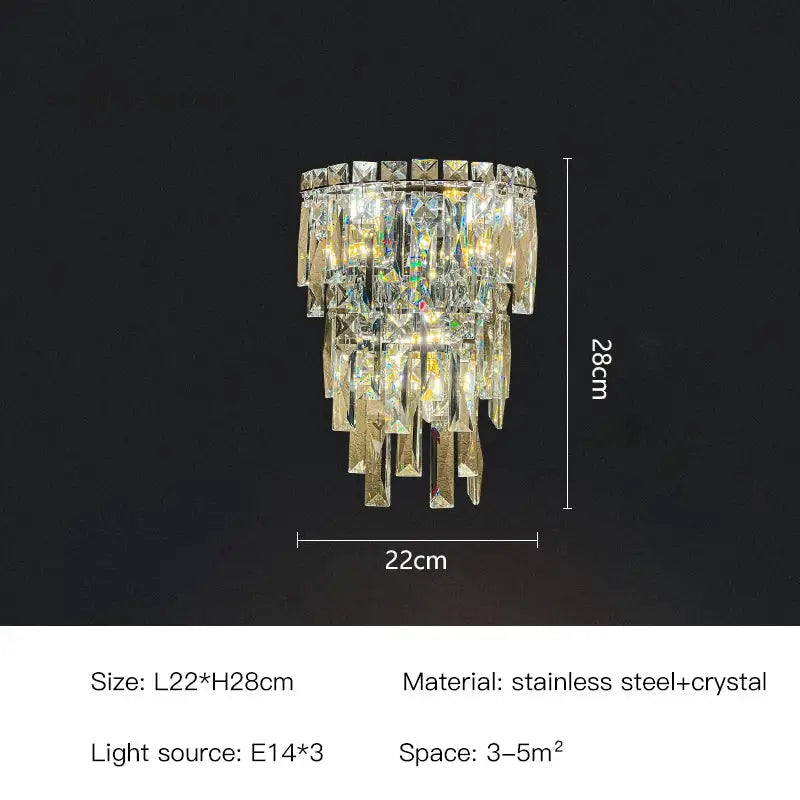 Tiered cascading crystal wall light with clear and gold-toned crystals on sleek stainless steel frame decorbites crystal wall