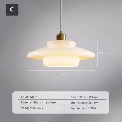 Cream glass pendant light with white frosted tiers and brass hardware fixture for dining room lighting