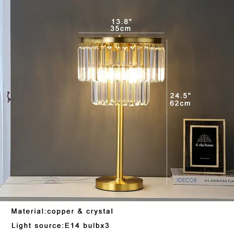 Gold-toned tiered crystal table lamp with slender stem and circular base for bedroom nightstand decorbites crystal table