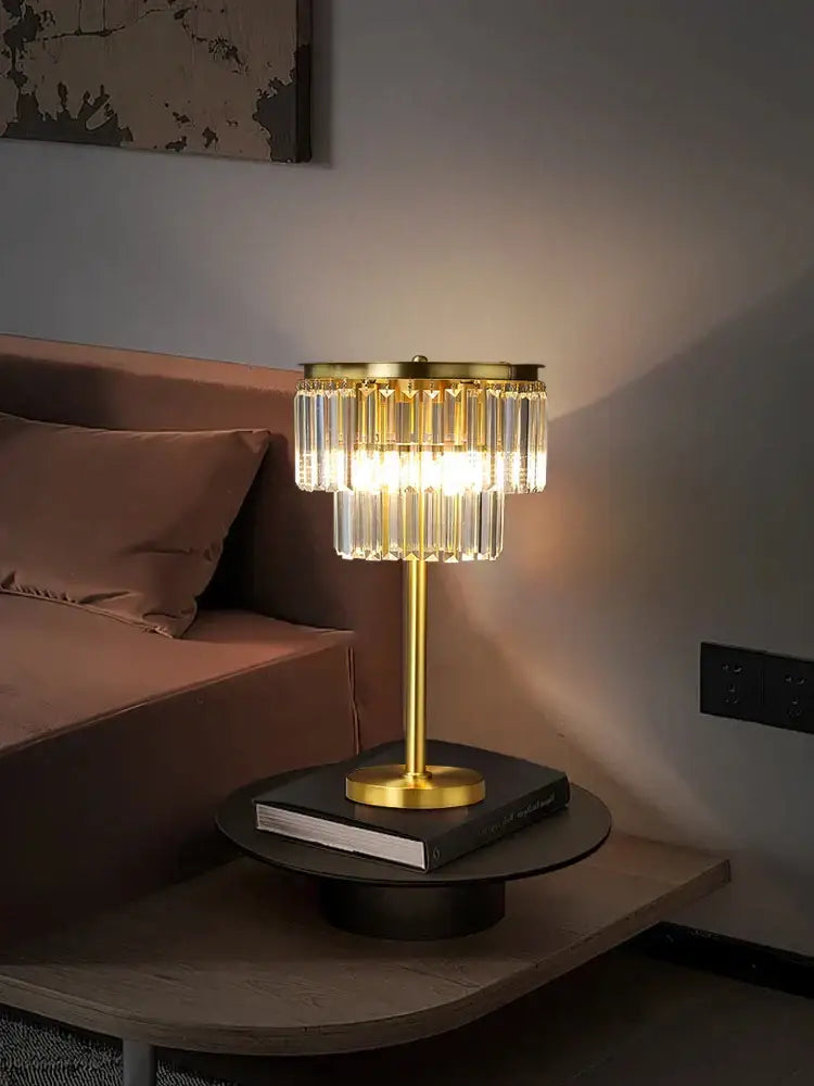 Tiered gold and gray crystal table lamp with a gold-finished base and cascading prisms warm decorbites crystal table light