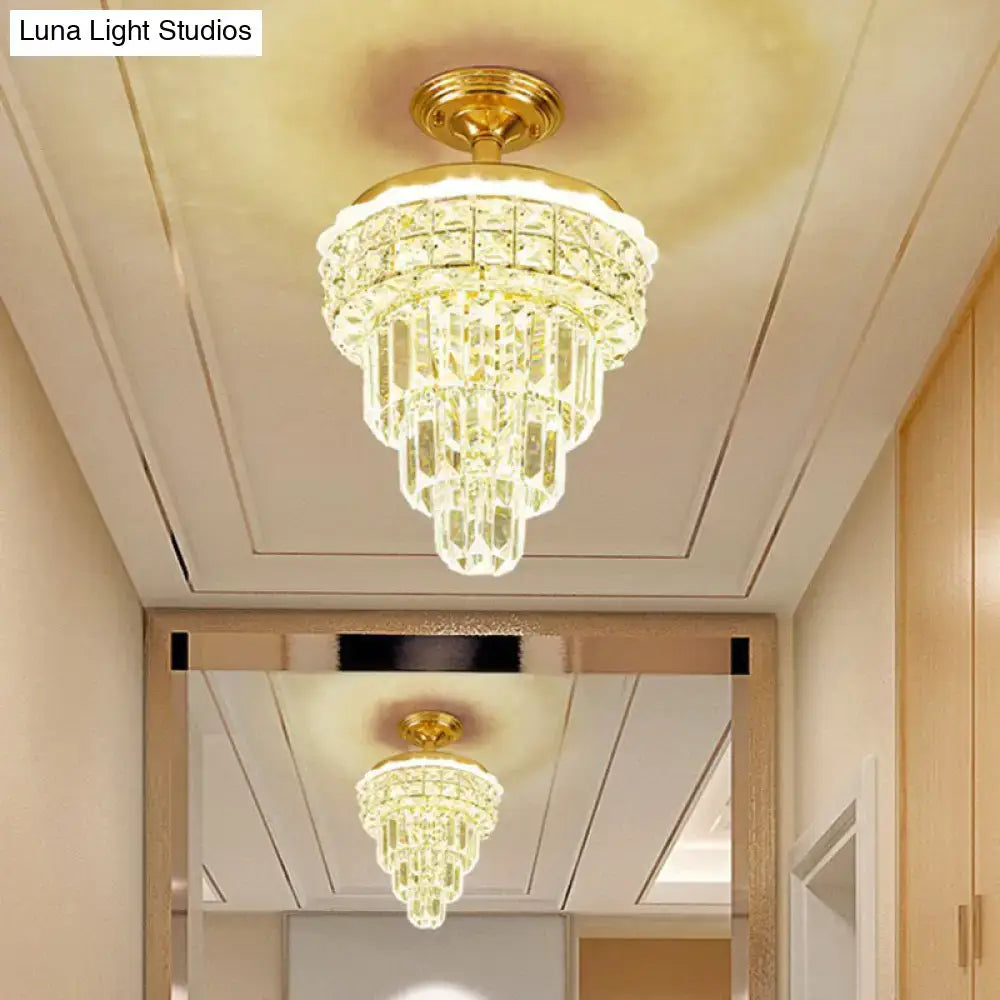 Gold-finished ceiling-mounted tiered gold and optical crystal foyer chandelier with cascading clear crystal prisms inch fixture