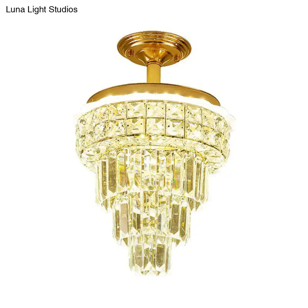 Tiered gold and optical crystal foyer chandelier with cascading tiers of clear faceted optical crystal prisms inch fixture