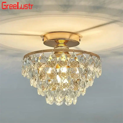 Tiered gold crystal led chandelier ceiling lamp with cascading teardrop-shaped crystal pendants for dining room decorbites crystal led