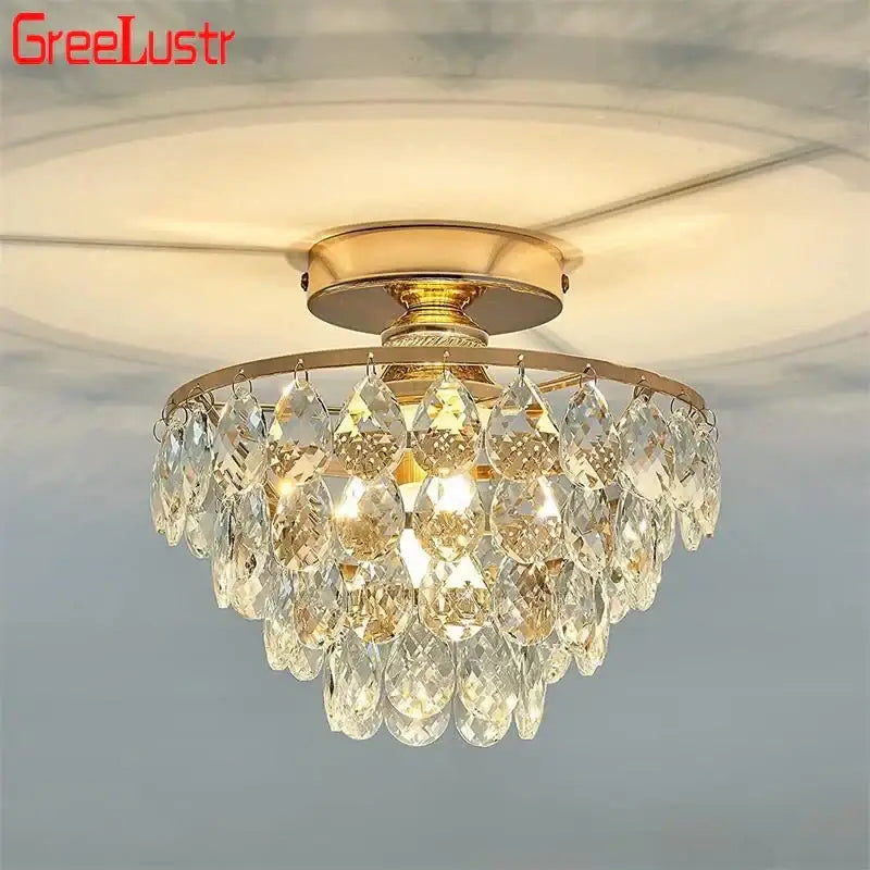 Tiered gold crystal led chandelier ceiling lamp with cascading teardrop-shaped crystal pendants for dining room decorbites crystal led