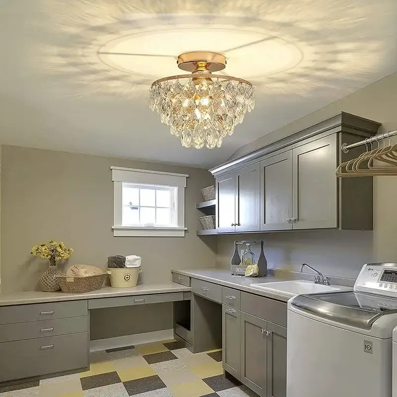 Tiered gold crystal led chandelier ceiling lamp featuring a gold-toned metal frame with clear crystal droplets decorbites crystal led