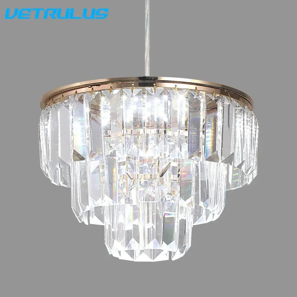 Tiered gold crystal led pendant light with clear faceted prisms and metal frame for dining room decorbites crystal led