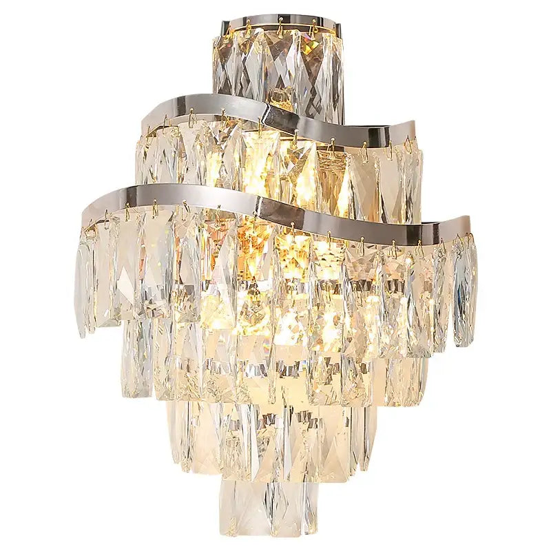 A tiered gold crystal wall lamp with cascading clear prisms and curved chrome bands perfect for living room decorbites crystal wall lamp