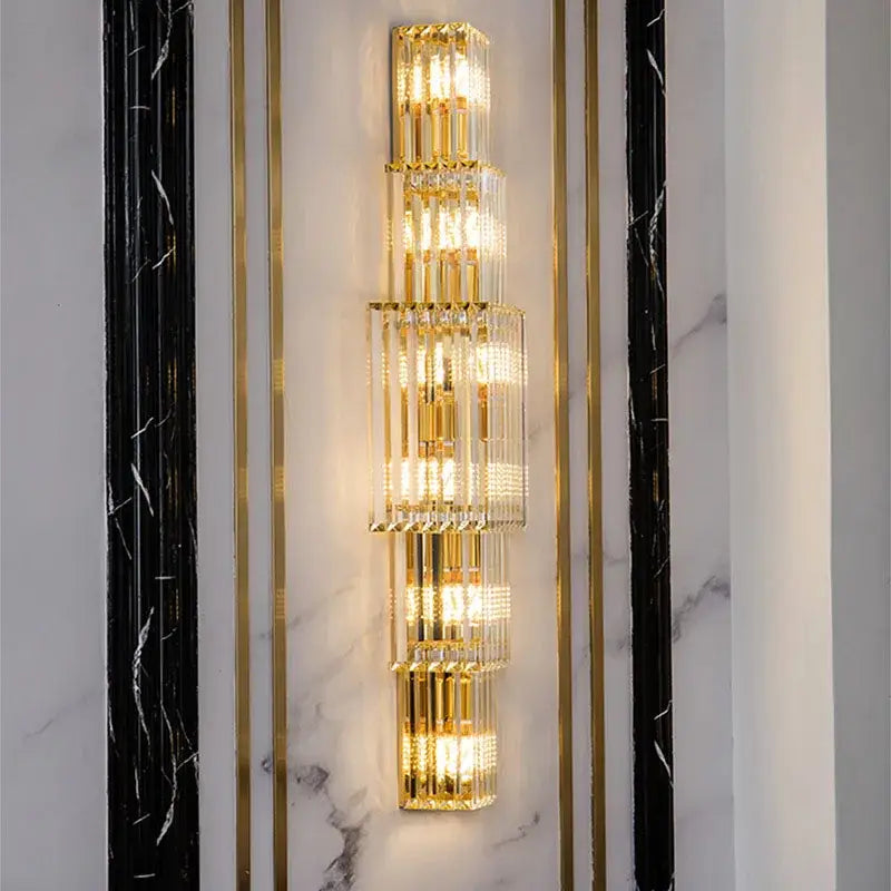Tiered gold crystal wall lamp with stacked clear crystal rods and illuminated led lights for living room decorbites wall lamp