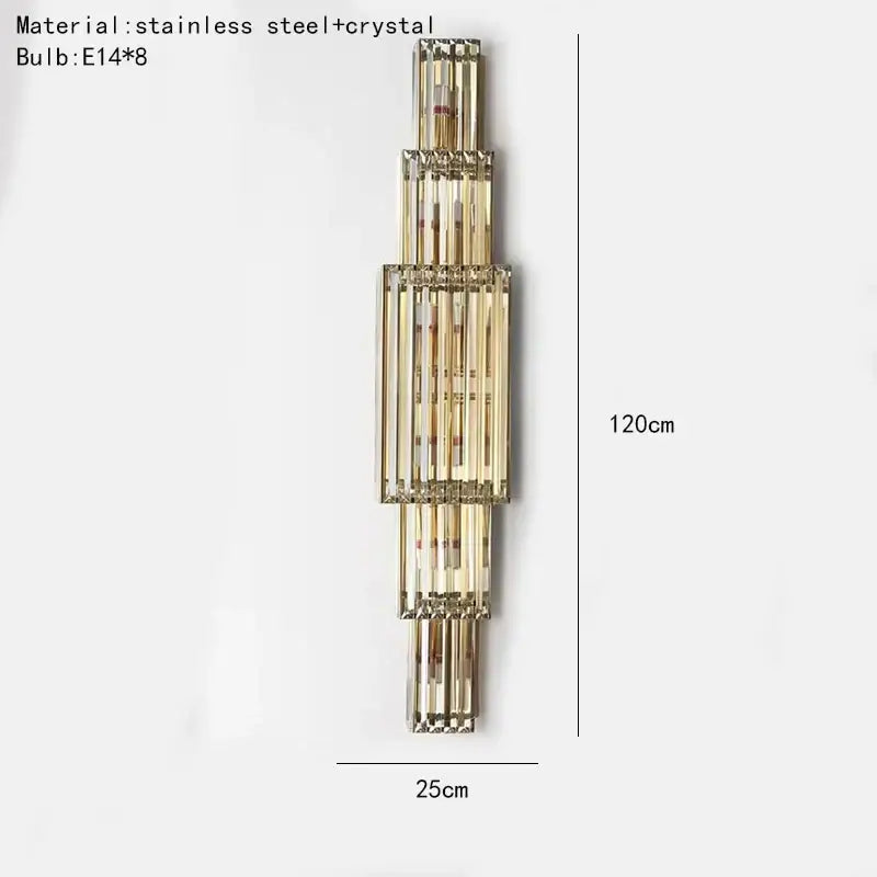A tiered golden decorbites clear glass wall lamp with stainless steel vertical elements for dining room sconce lighting