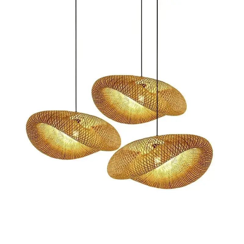 Three golden woven pendant lights of decorbites bamboo chandelier with modern organic design for dining room lighting