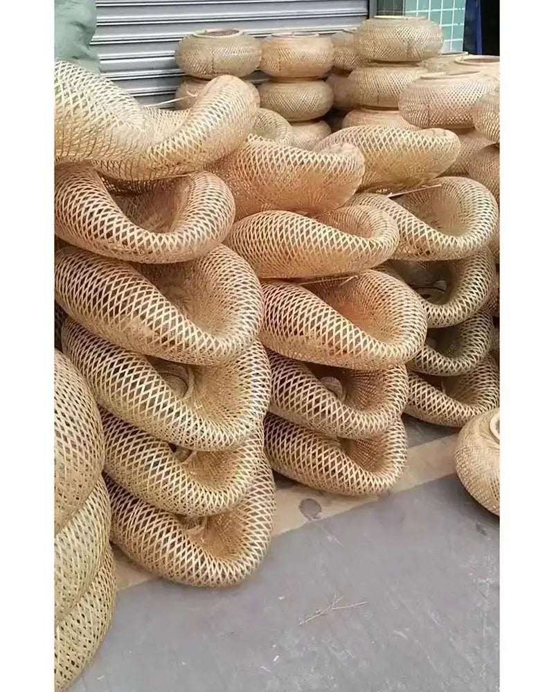 Handwoven natural bamboo rattan baskets with twisted ring shape and open lattice design in decorbites bamboo chandelier