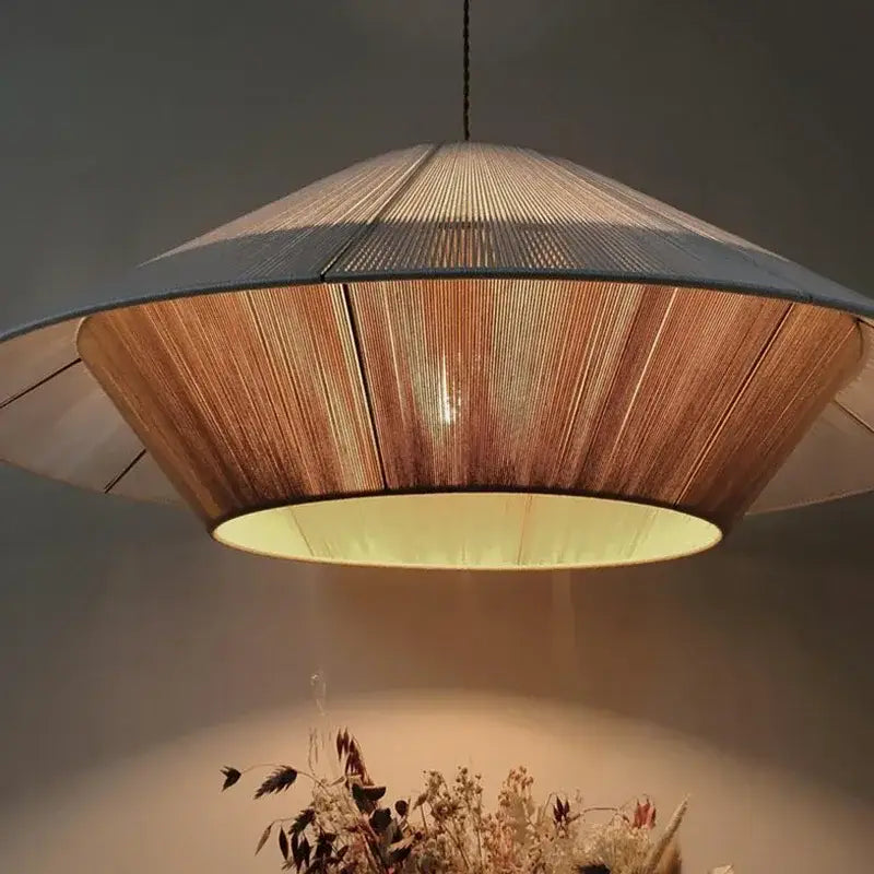 A warm-toned conical pendant light with woven bamboo shade and soft yellow lining for dining room decorbites hemp rope rattan