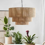Tall tiered pendant wall lamp with natural woven rattan shade and black chain suspension decorbites hemp rope wall