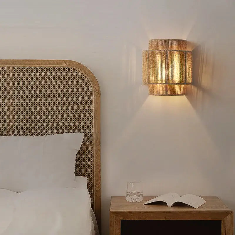 Tiered rattan hemp rope wall lamp with warm tones and woven cylindrical design for bedroom and living room decorbites hemp rope