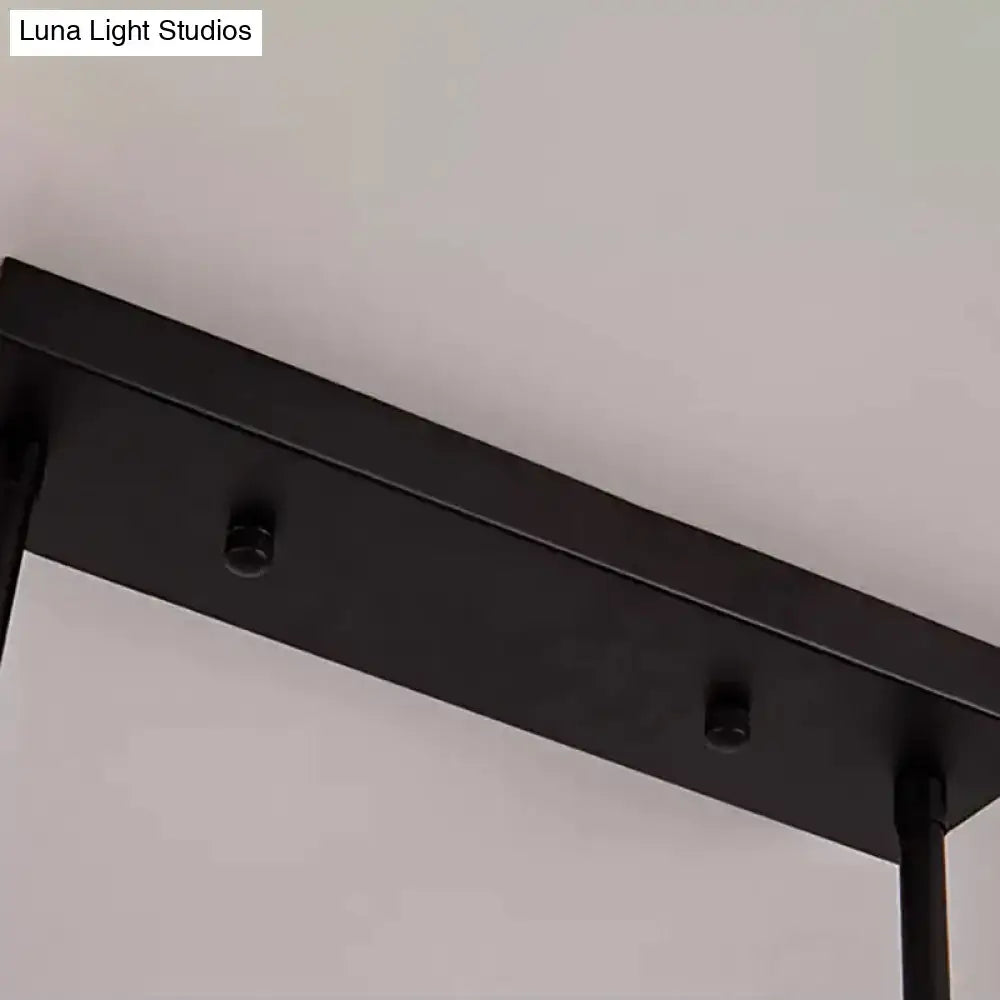 Black matte-finished metal ceiling fixture with sleek rectangular design for kitchen island lighting by DecorBites™