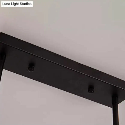 Black matte-finished metal ceiling fixture with sleek rectangular design for kitchen island lighting by DecorBites™