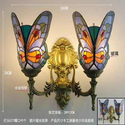 Ornate gold-toned butterfly glass sconces with iridescent blue orange and green shades for bedroom wall lamps decorbites butterfly glass