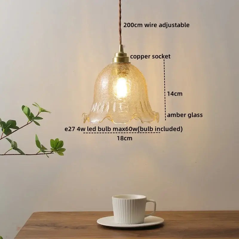 A warm amber glass copper led pendant lamp with adjustable wire and copper socket for dining room lighting
