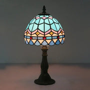 A tiffany stained glass table lamp with a dome shade in blue pink gold and red beads 110v-120v for bedroom use