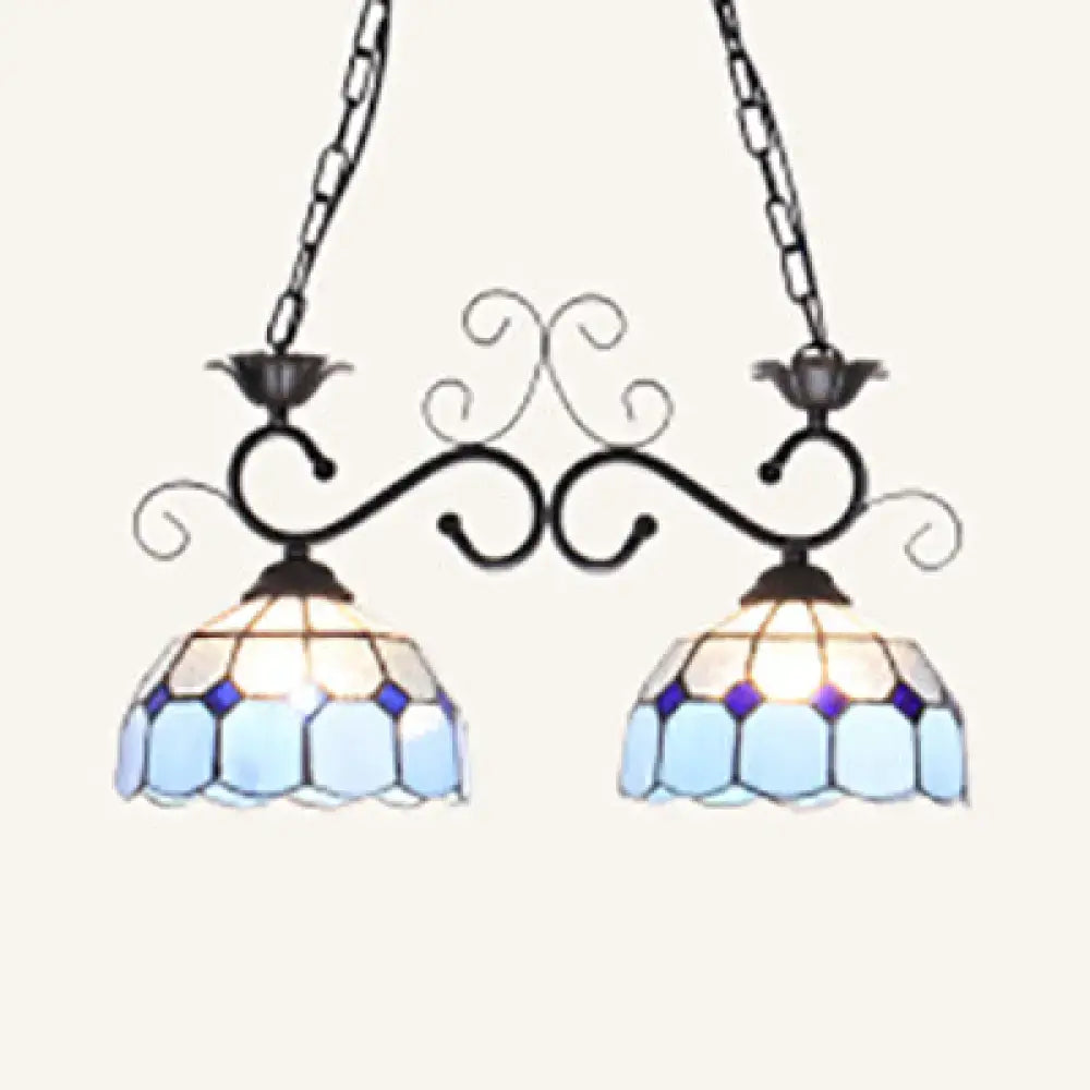 DecorBites stunning Tiffany-style pendant light with blue and white stained glass and ornate black metal arms
