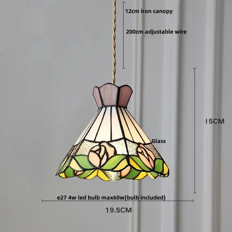 A tiffany style pink and peach butterfly glass flower led pendant lamp with floral design in leaded glass panels